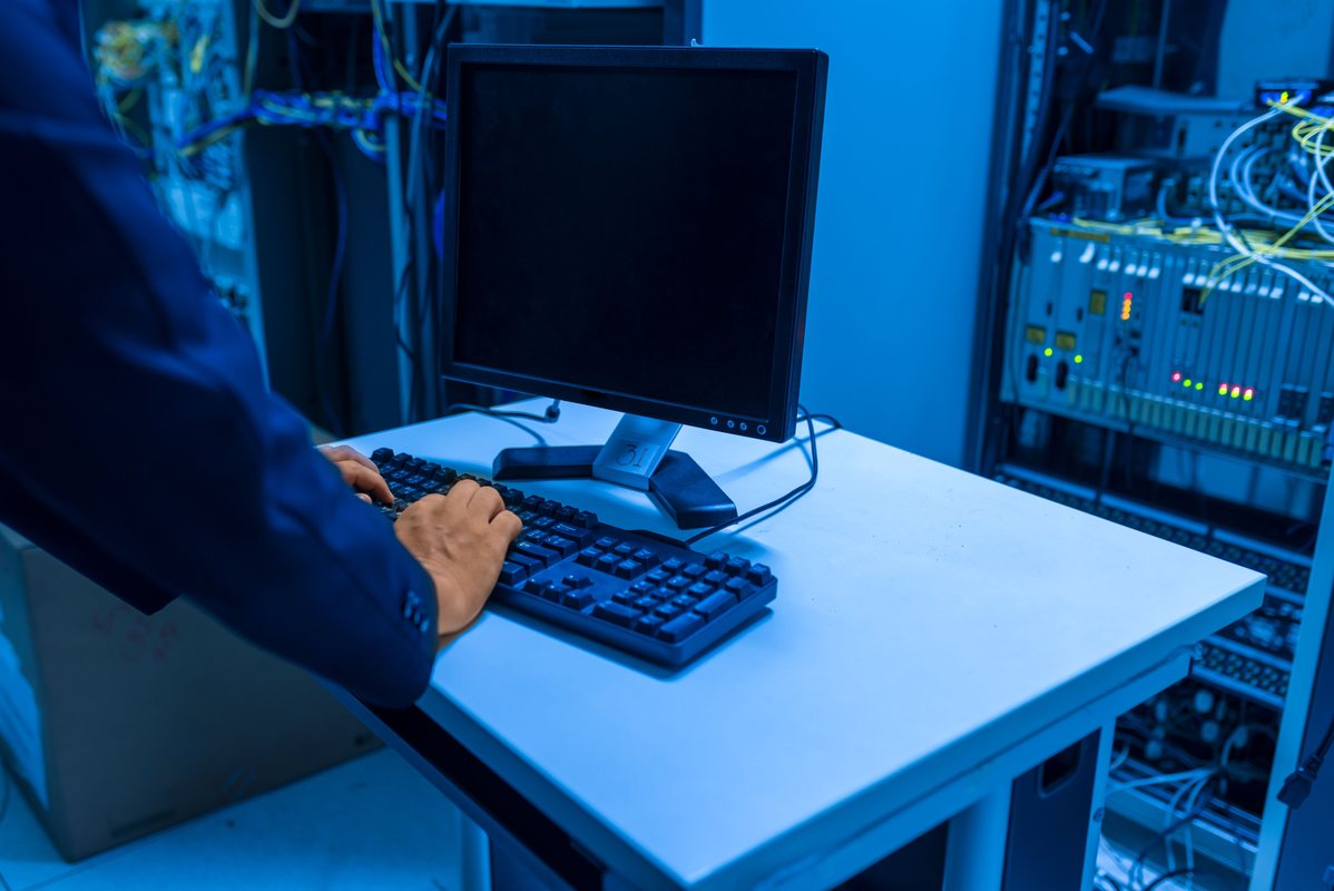 IT professional managing business systems in a server room